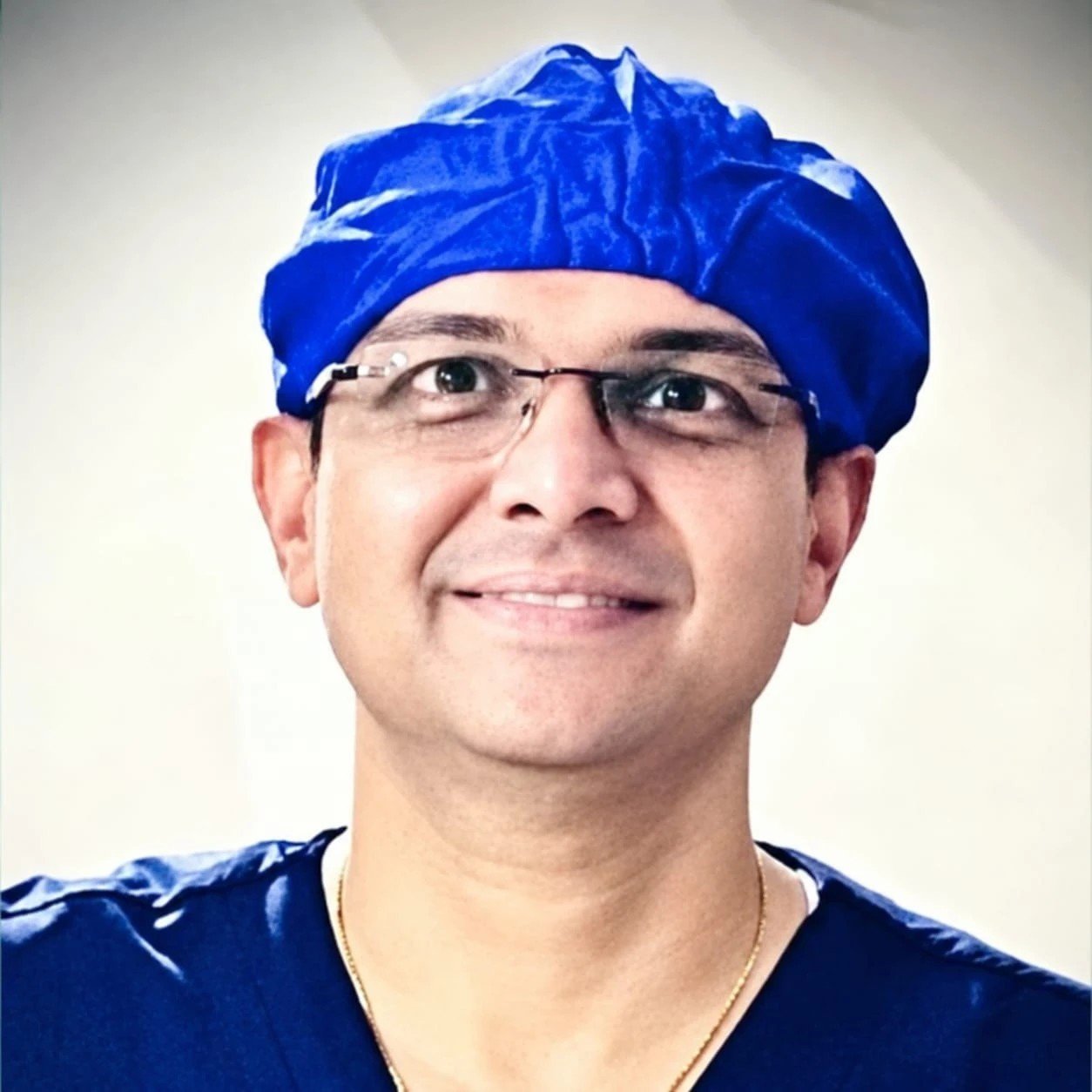 Dr. Anand Shah in surgical scrubs